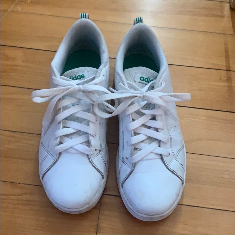 White adidas sneakers.